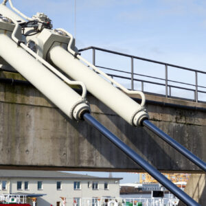 Large hydraulic cylinders for moving a swing bridge over a harbor basin