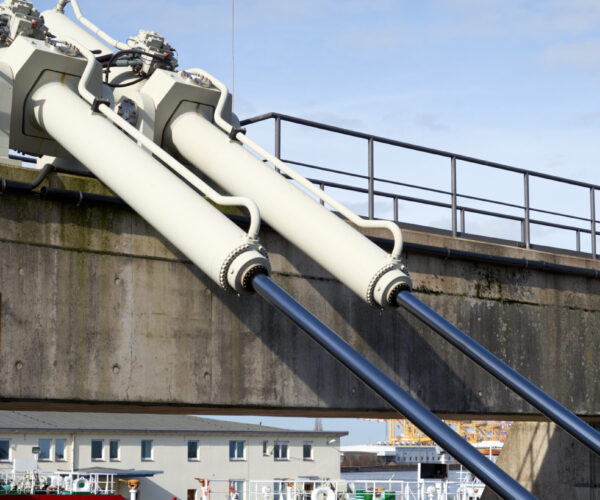 Large hydraulic cylinders for moving a swing bridge over a harbor basin